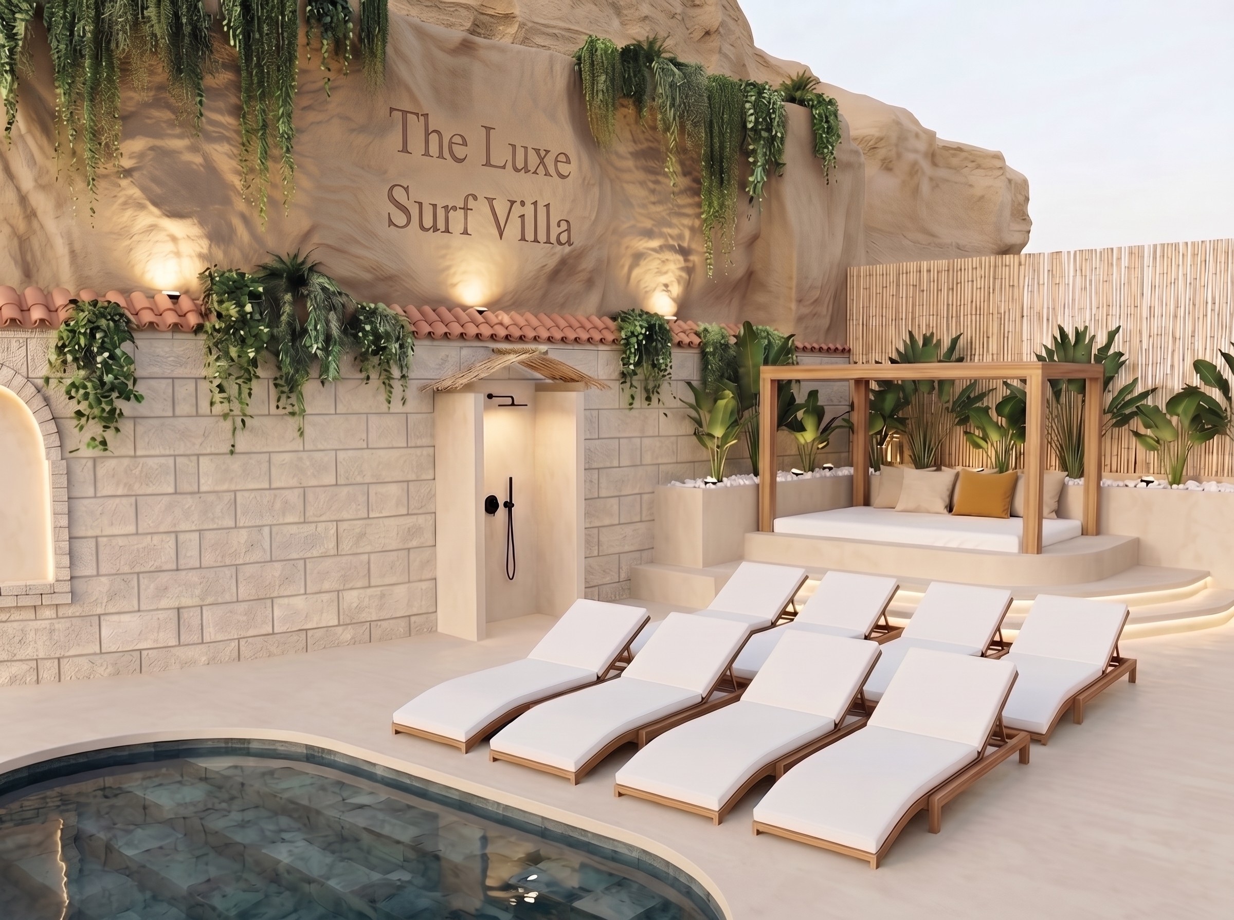 Heated pool, sun loungers and Bali bed below the rock face